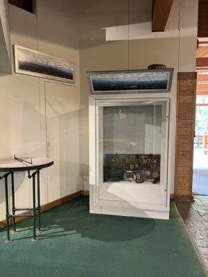 Panel on case with some items inside. and Osborne table 